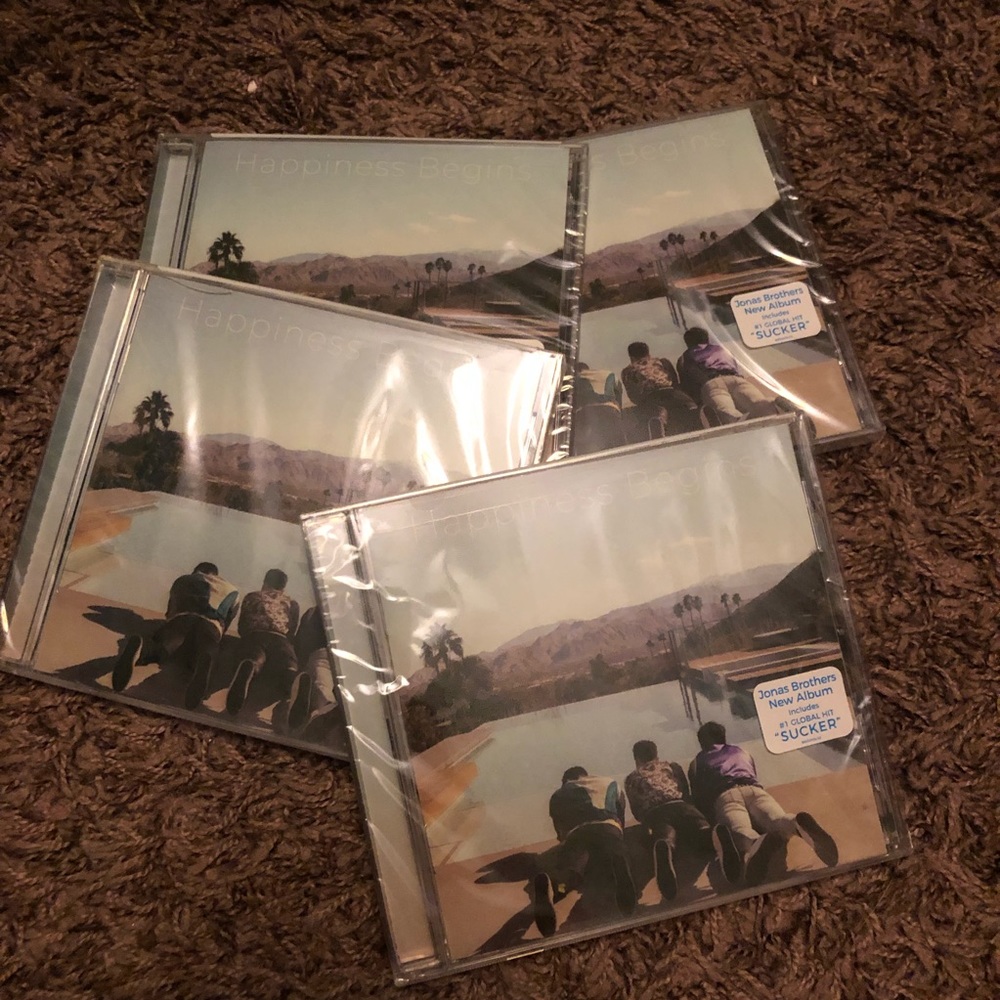 Two Jonas Brothers Happiness Begins CD's